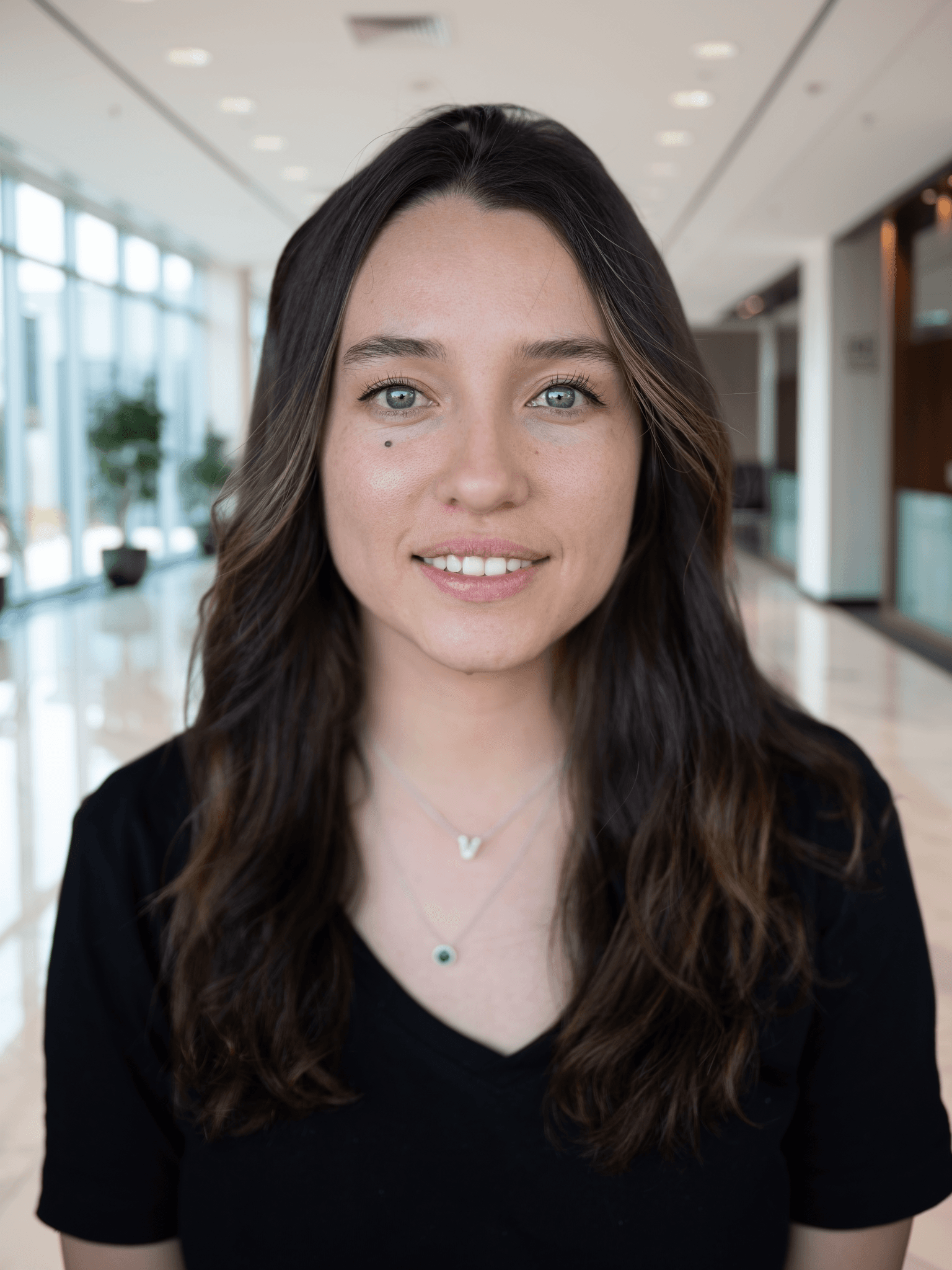 Portrait with background replaced to corporate office lobby by FLUX.2 Flex