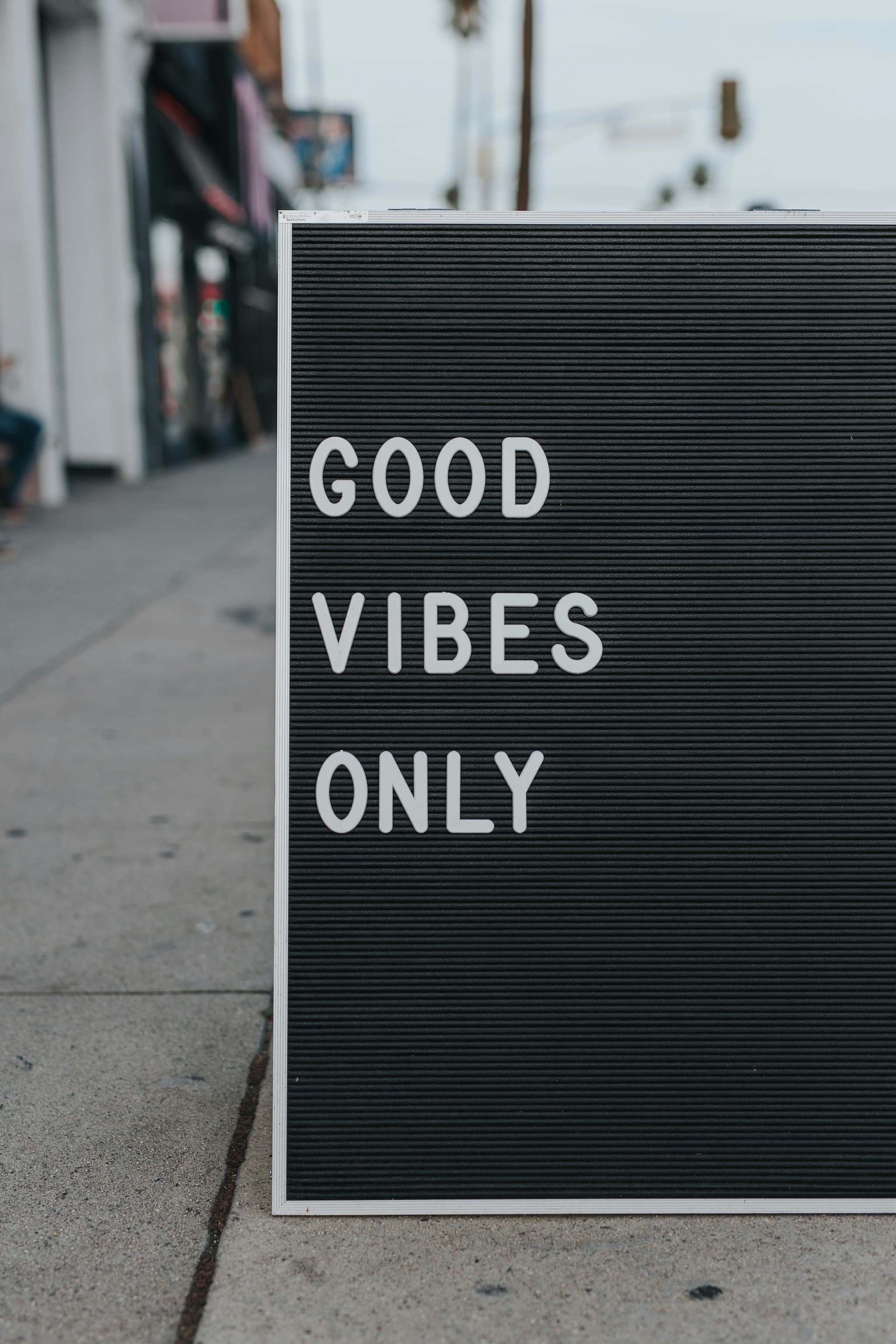 Original letter board sign reading "GOOD VIBES ONLY" used as input for the text replacement comparison