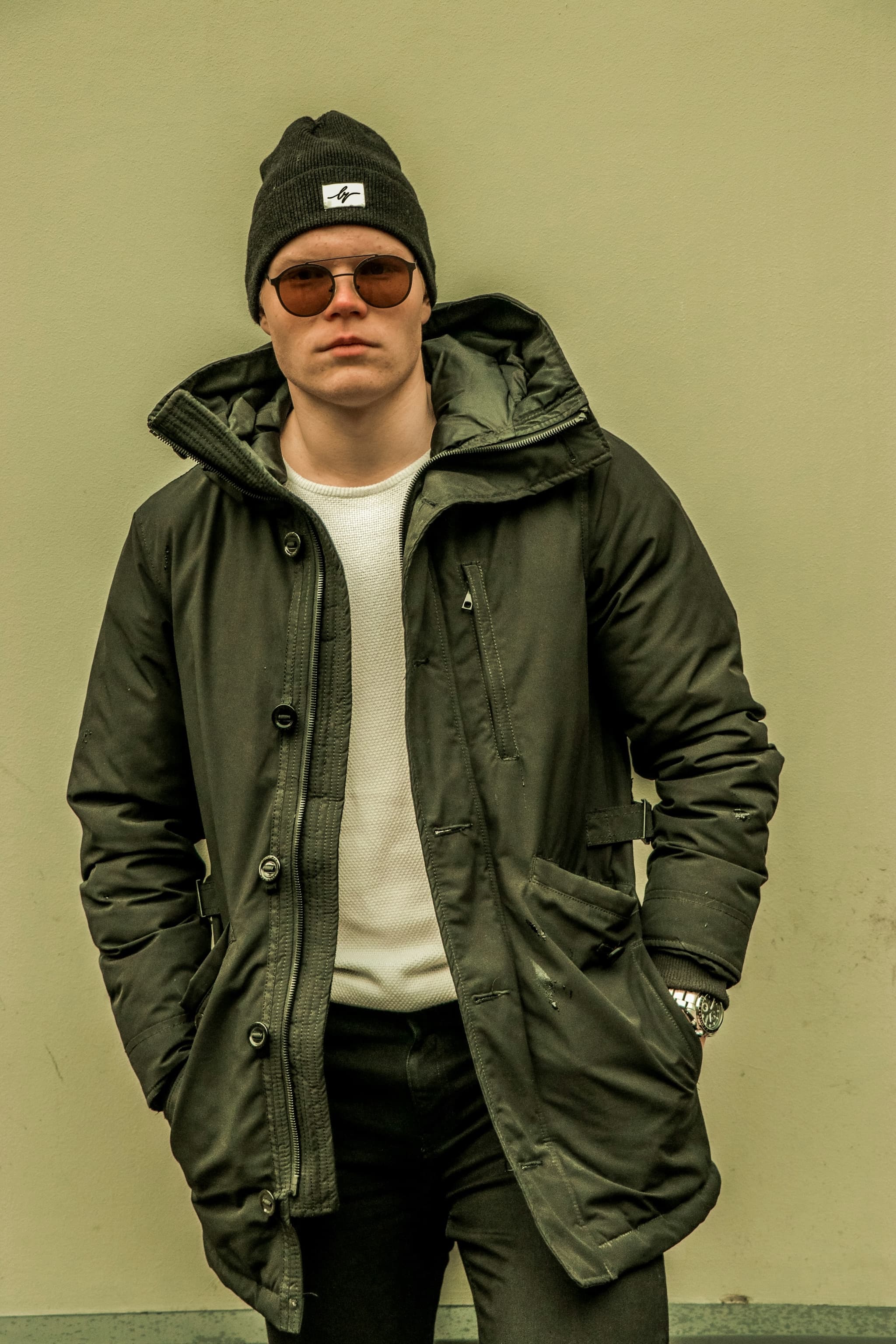 Original street portrait with dark green parka used as input for the clothing replacement comparison