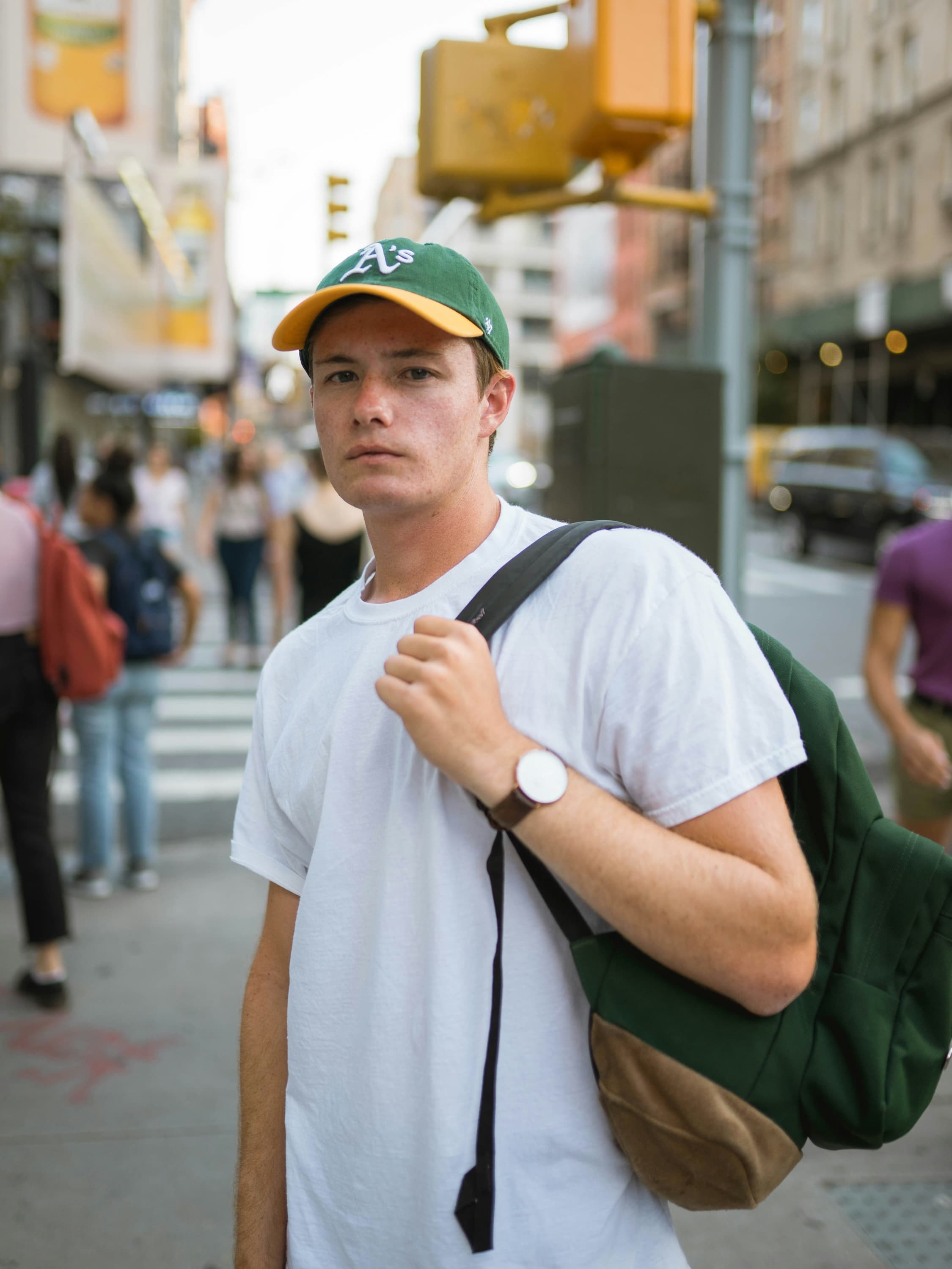 Original street portrait input image with background pedestrians before object removal