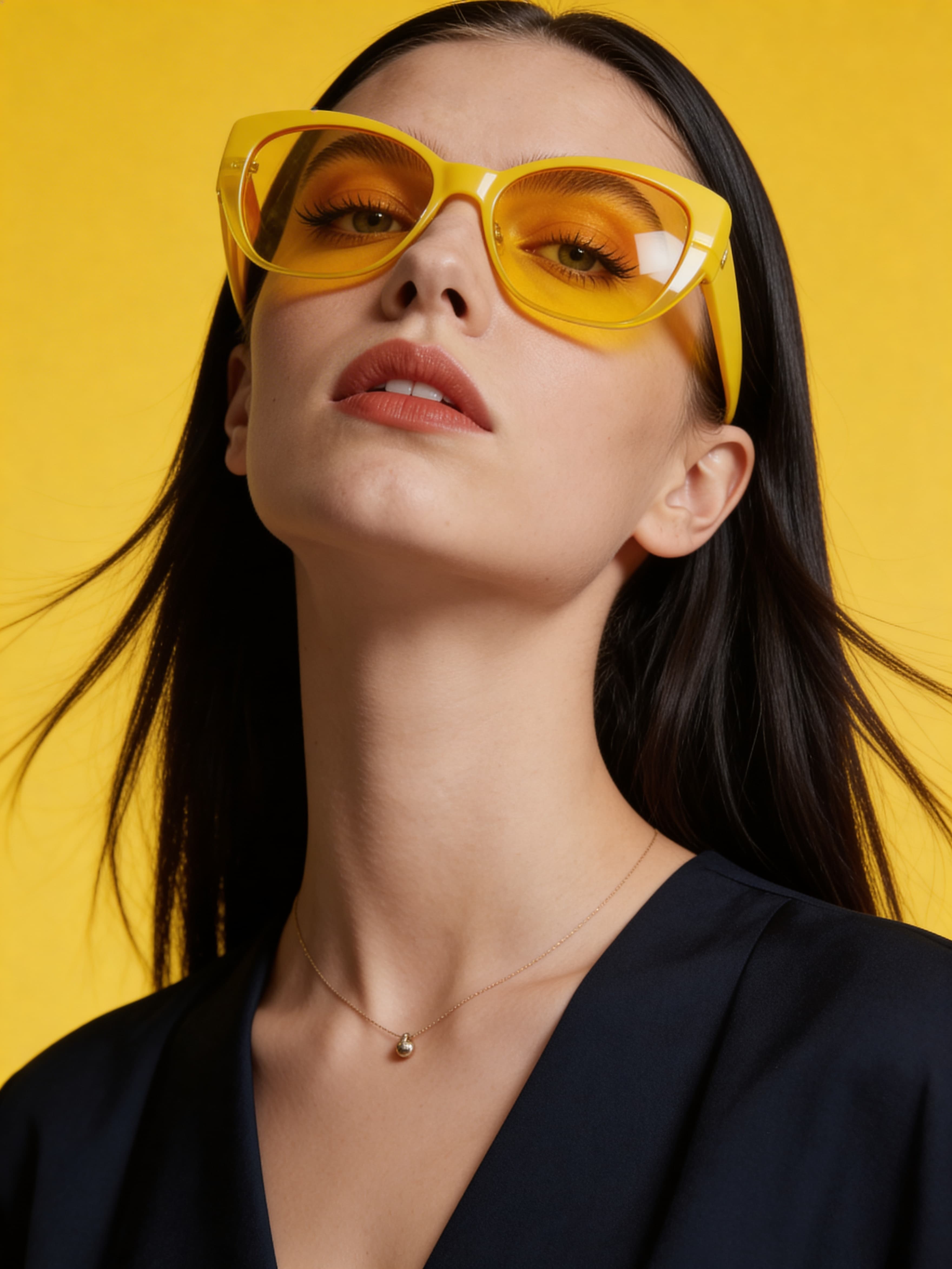 Example: glamorous close-up portrait with yellow sunglasses on vibrant yellow backdrop