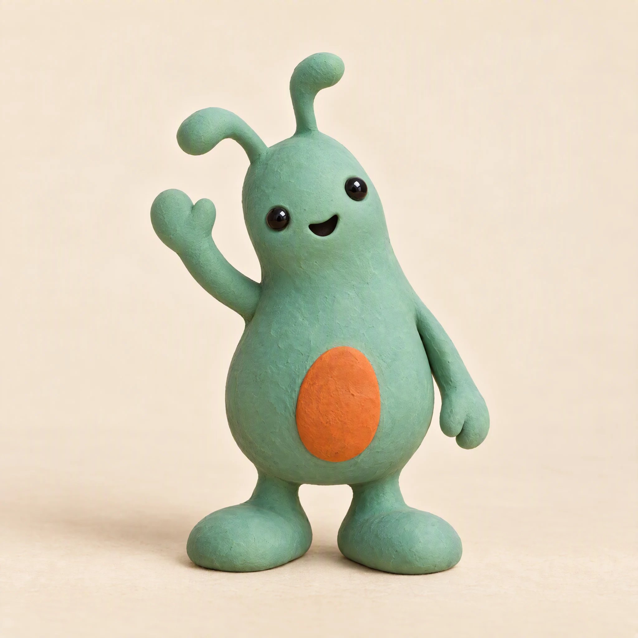 Mascota verde de plastilina levantando una mano para saludar.