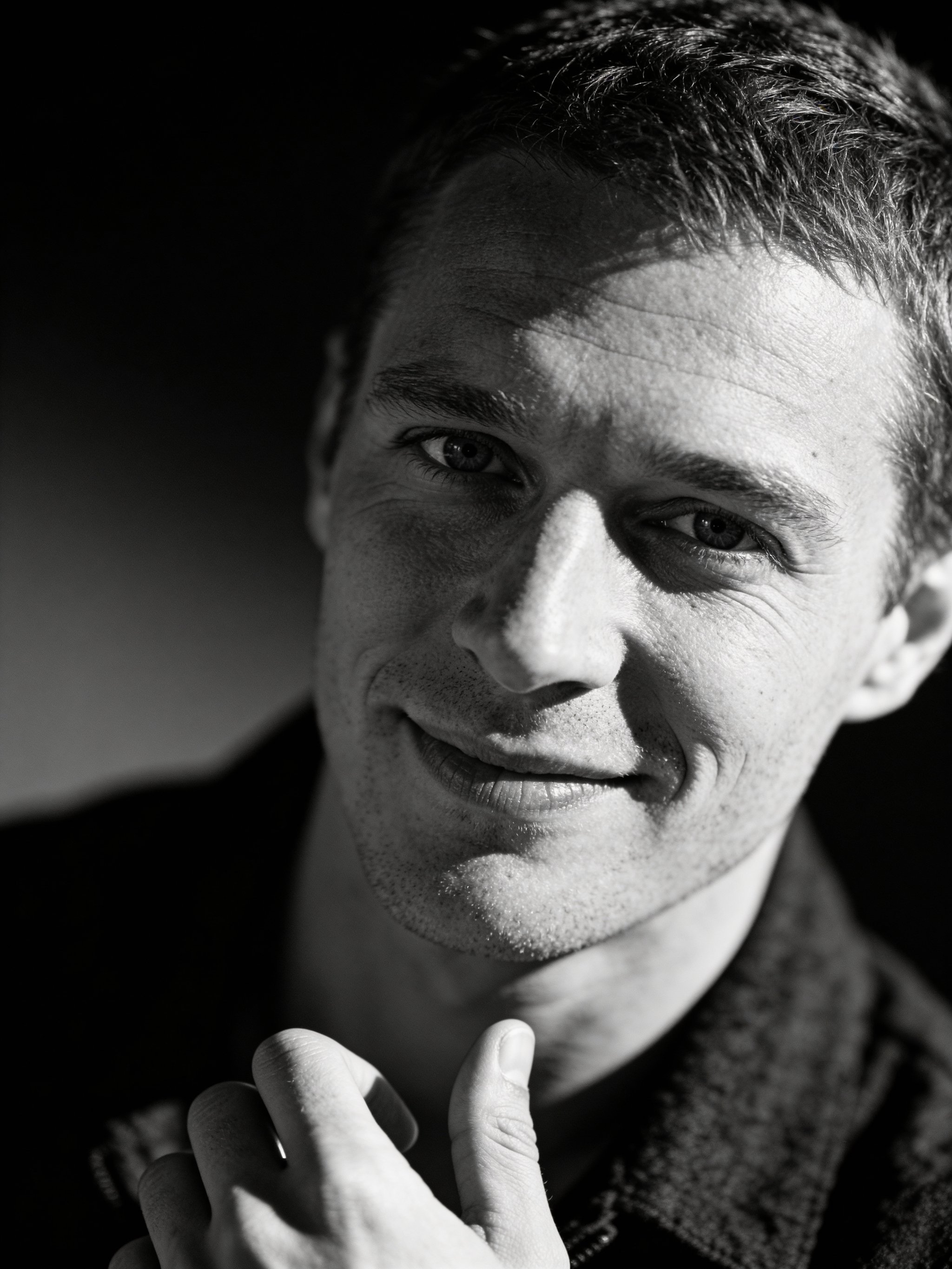 Black and white editorial portrait with sharp eye focus