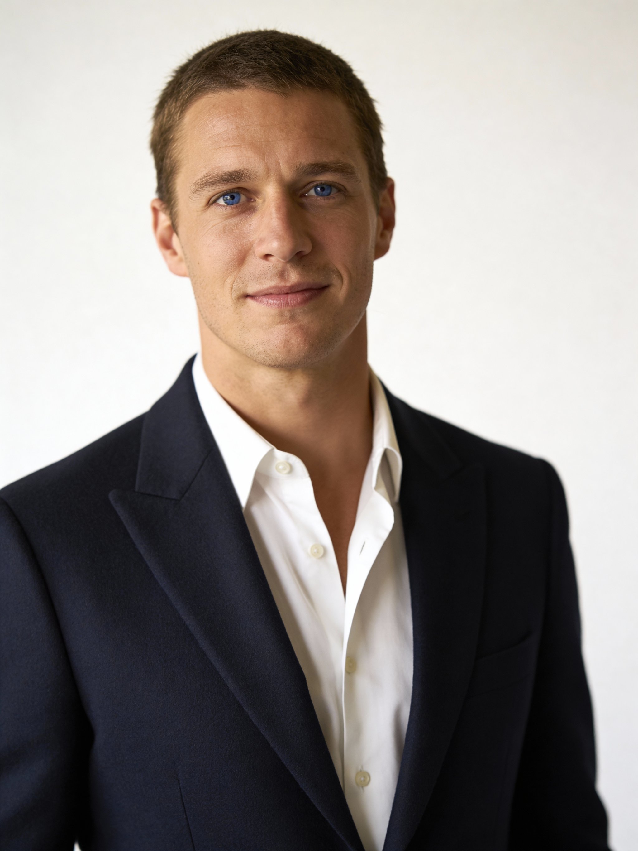 Editorial studio headshot with sharp eye focus