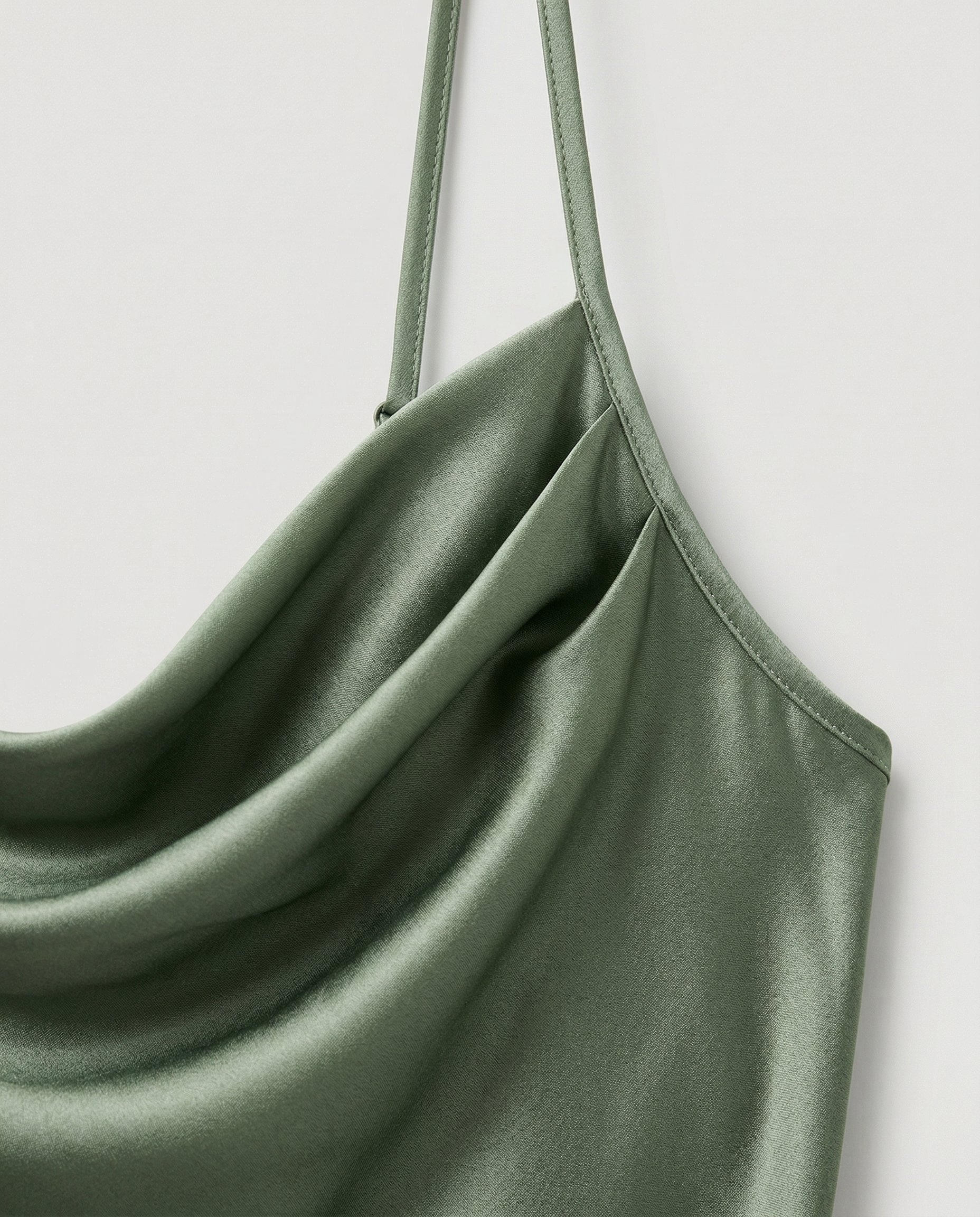 Macro detail photo of the fabric texture and construction of the sleeveless midi dress