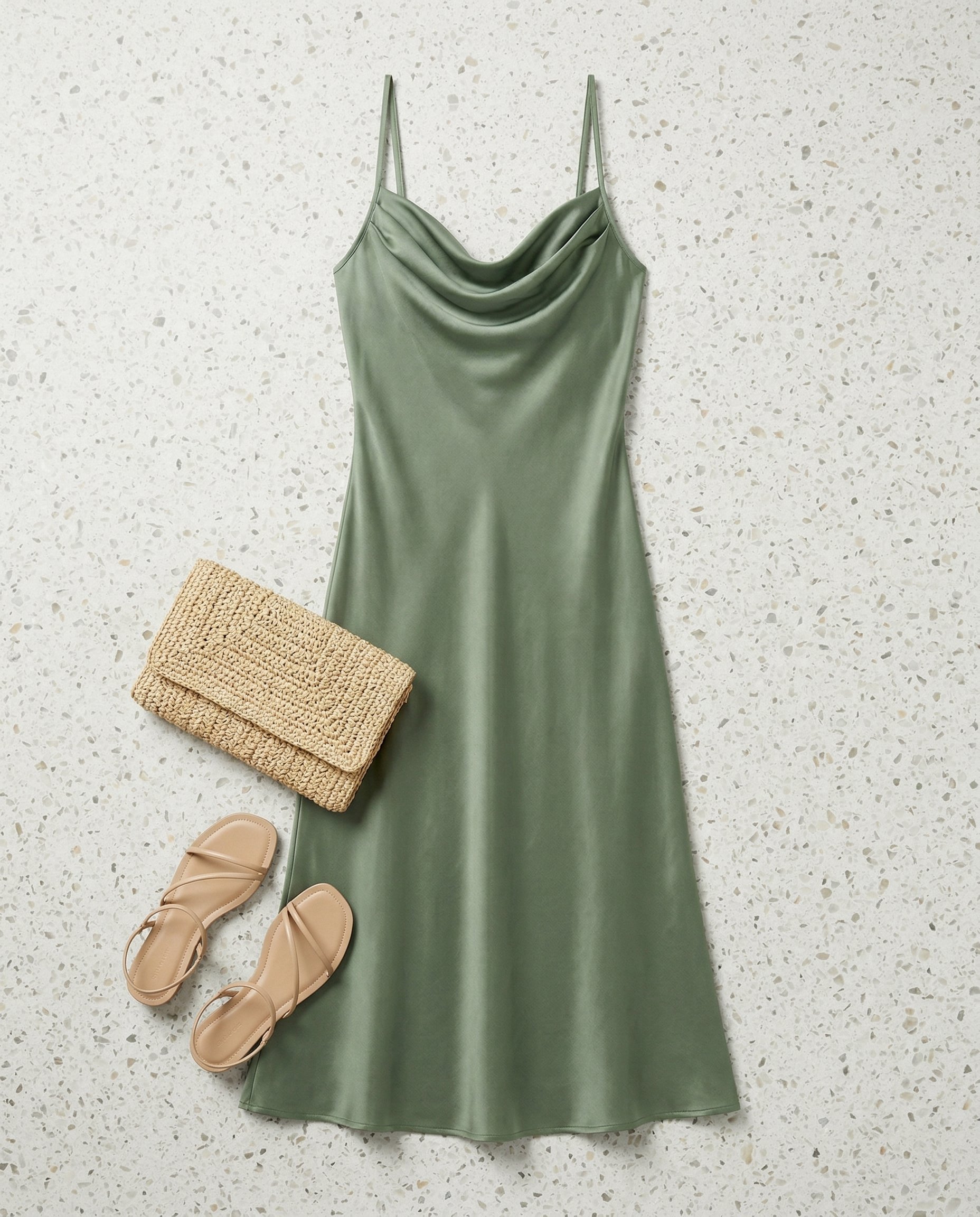 Styling and scale reference image of the sleeveless midi dress in a shopper-friendly outfit context