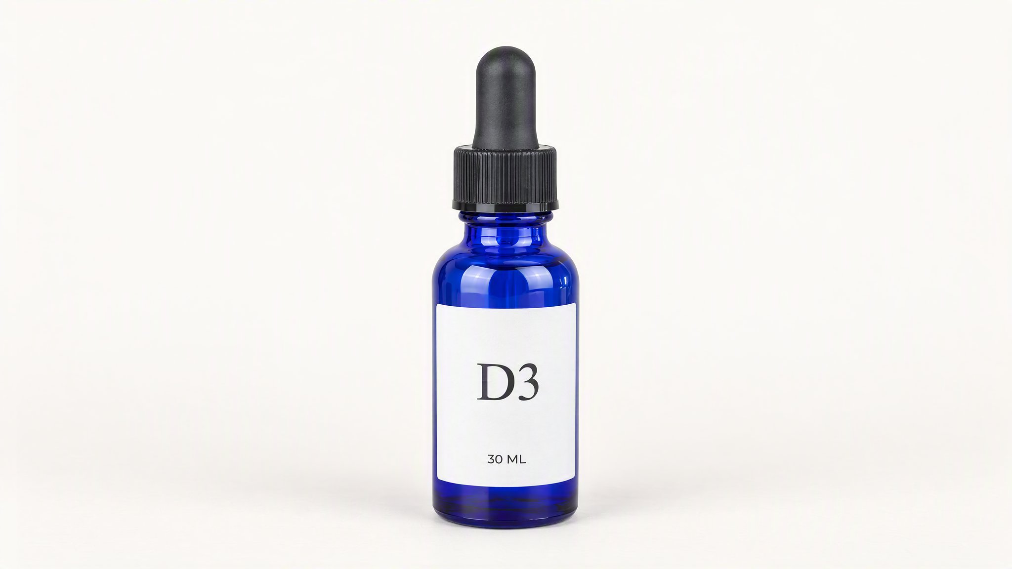 Cobalt D3 dropper bottle on an ivory studio background