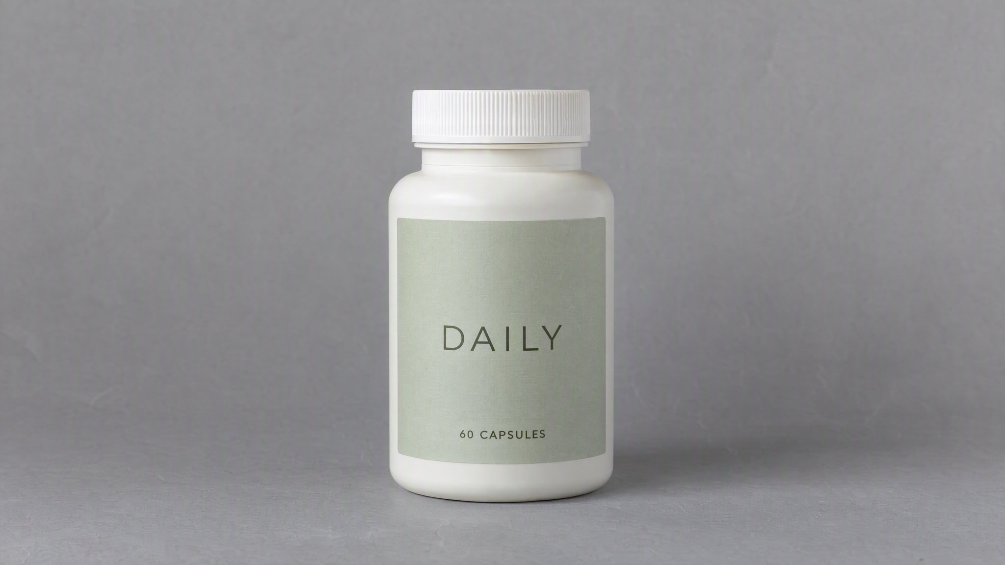 Ivory DAILY supplement bottle with a sage label on gray paper, generated with AI