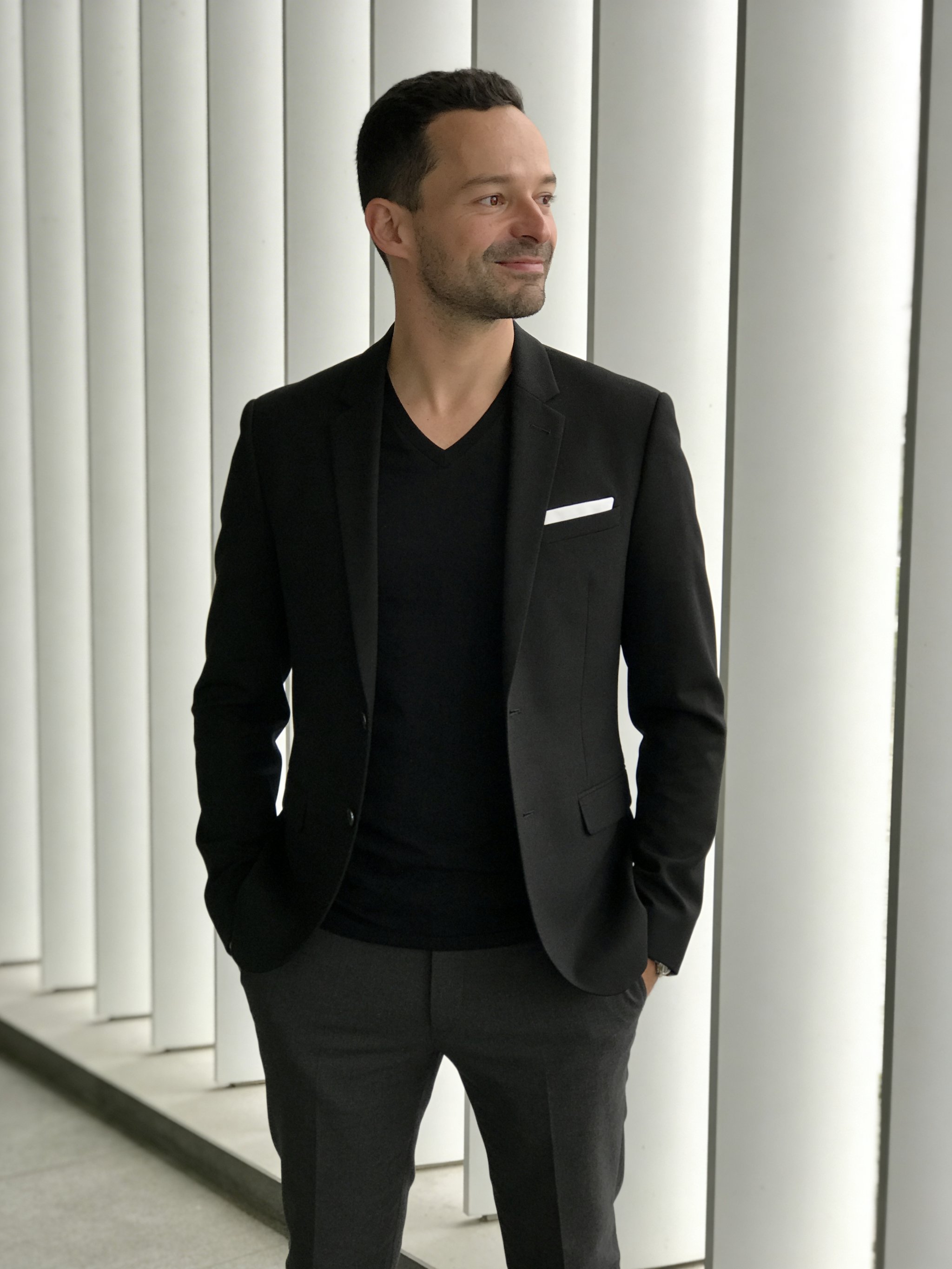 Example: black blazer architectural panel portrait