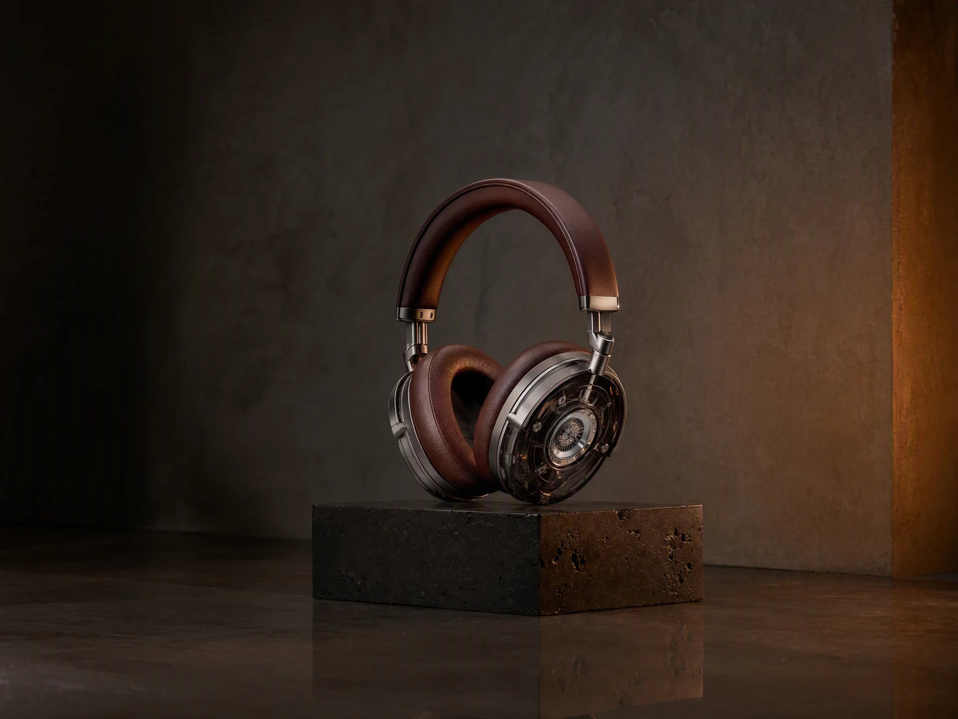 Titanium and oxblood headphones on dark stone, generated with GPT Image 2